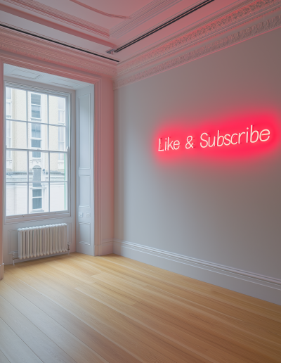 Like & Subscribe neon wall sign.